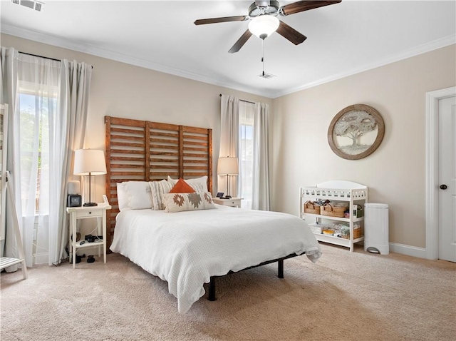 1195 Southridge Ct, Auburn, AL 36830 - bedroom with multiple windows, crown molding, carpet, ceiling fan, and baseboards