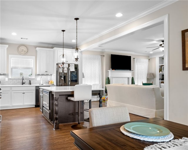 1195 Southridge Ct, Auburn, AL 36830 - dining room with plenty of natural light, crown molding, dark wood finished floors, recessed lighting, and ceiling fan