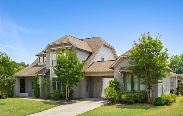 1195 Southridge Ct, Auburn, AL 36830 - view of front facade with concrete driveway, a front yard, roof with shingles, and a garage