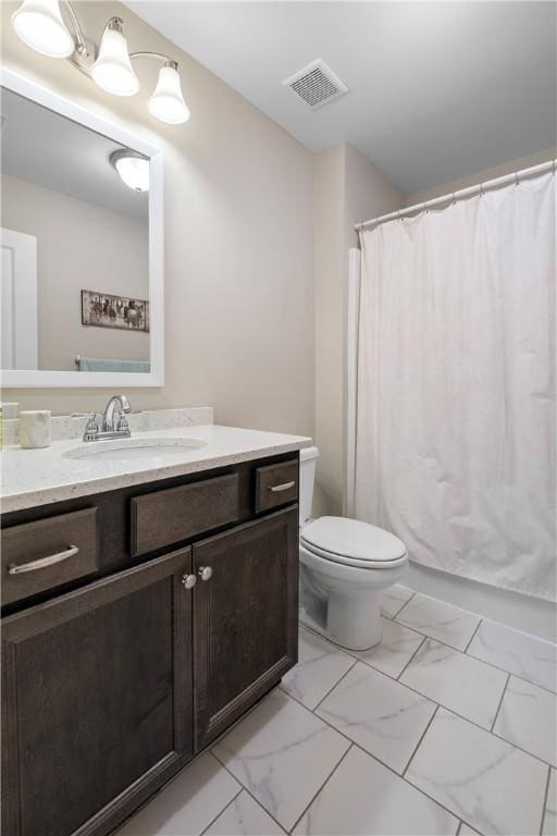 1195 Southridge Ct, Auburn, AL 36830 - bathroom with vanity, toilet, and marble look tiles