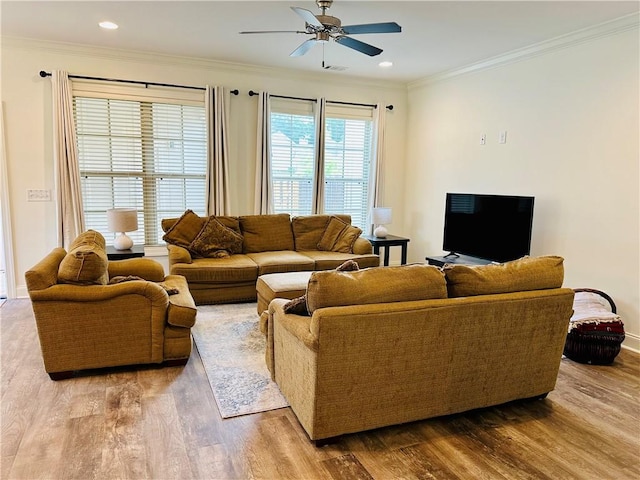 living room featuring ornamental molding, a ceiling fan, recessed lighting, and wood finished floors