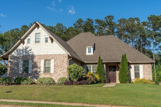 920 Andrews Ave, Auburn, AL 36832 - view of front of home featuring brick siding, a front yard, and roof with shingles
