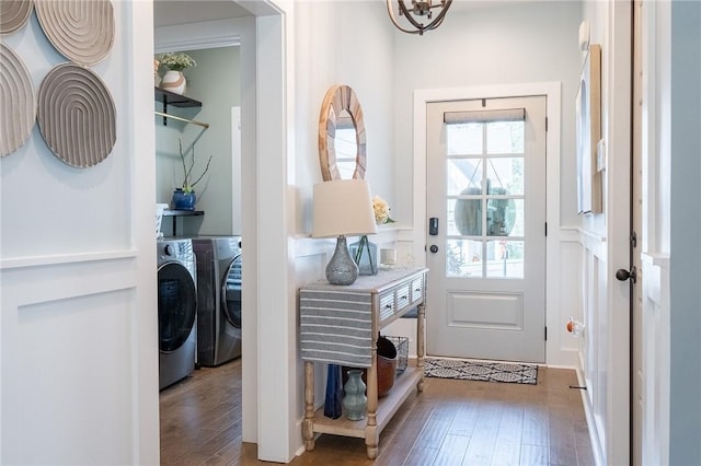 doorway featuring dark hardwood / wood-style flooring and washer and dryer