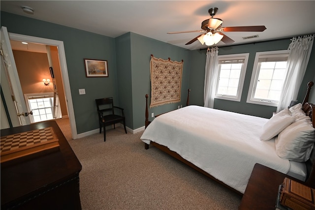 bedroom with ceiling fan and carpet flooring