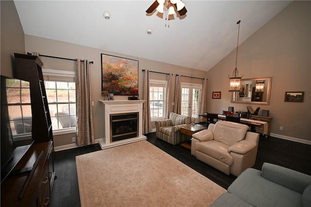 living room featuring lofted ceiling, a healthy amount of sunlight, and ceiling fan