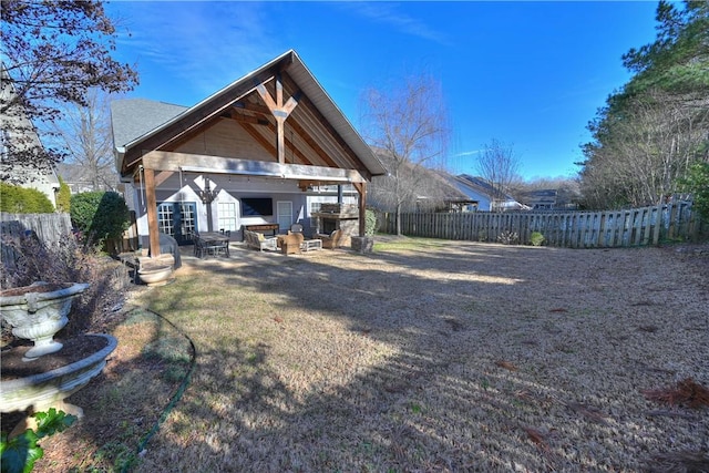 rear view of property featuring a patio area