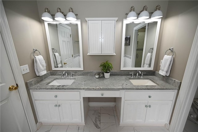 bathroom with a shower and vanity