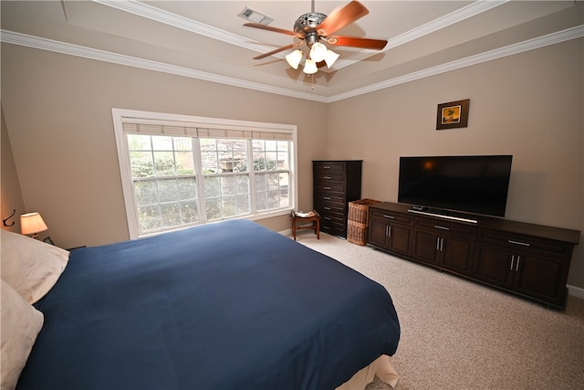 carpeted bedroom featuring ceiling fan, ornamental molding, and a raised ceiling