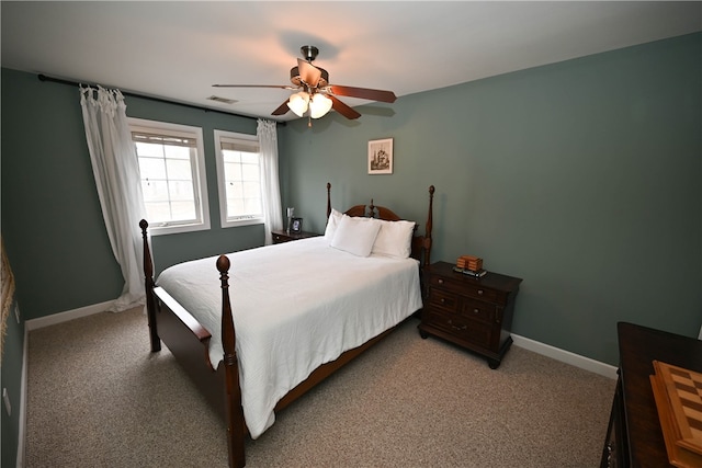 bedroom featuring ceiling fan and carpet