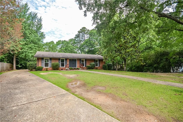 222 Green St, Auburn, AL 36830 - view of front of home featuring brick siding and concrete driveway