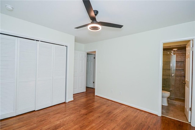 222 Green St, Auburn, AL 36830 - unfurnished bedroom featuring wood finished floors, a closet, ensuite bathroom, baseboards, and ceiling fan