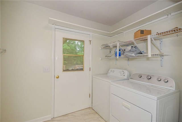 222 Green St, Auburn, AL 36830 - washroom featuring separate washer and dryer and light marble finish floors