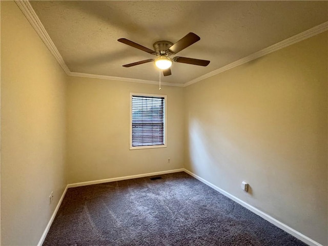 spare room featuring ornamental molding, ceiling fan, baseboards, dark carpet, and a textured ceiling