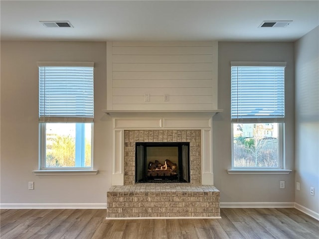 details with a fireplace and hardwood / wood-style flooring