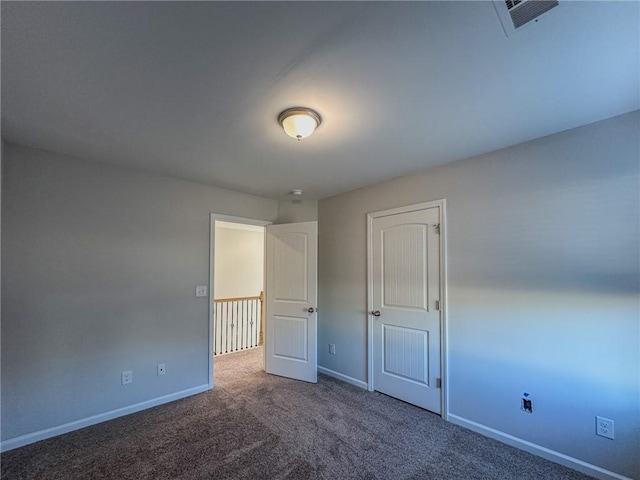 unfurnished bedroom with carpet floors