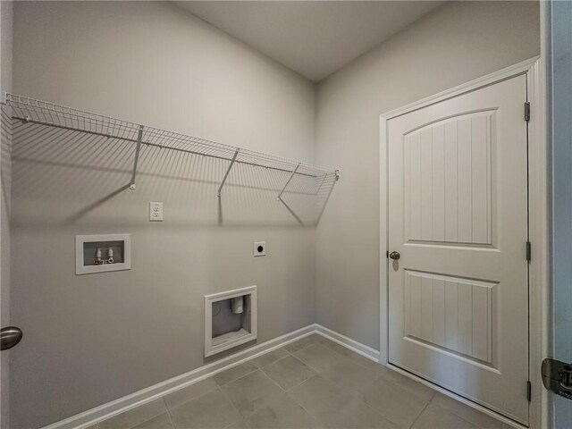 washroom with light tile patterned floors, washer hookup, and electric dryer hookup