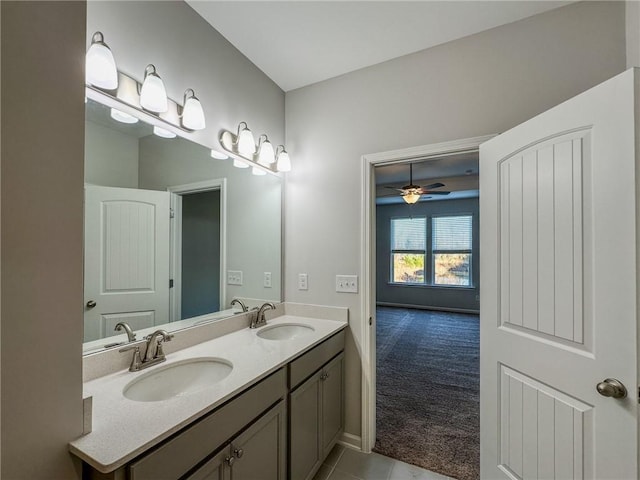 bathroom featuring ceiling fan, tile patterned flooring, and vanity