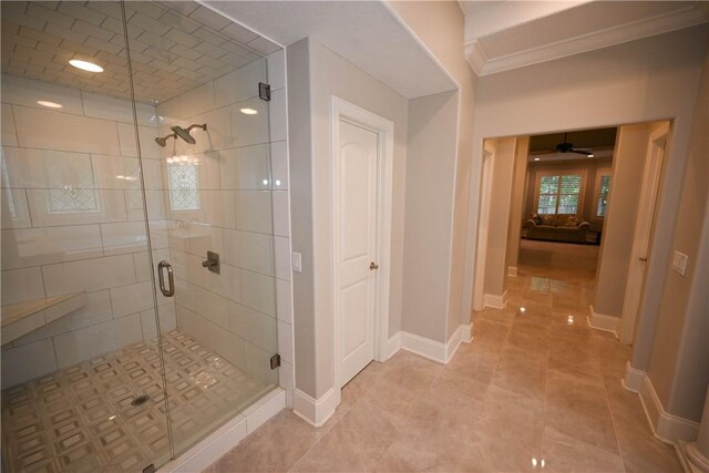 bathroom featuring walk in shower, crown molding, and ceiling fan