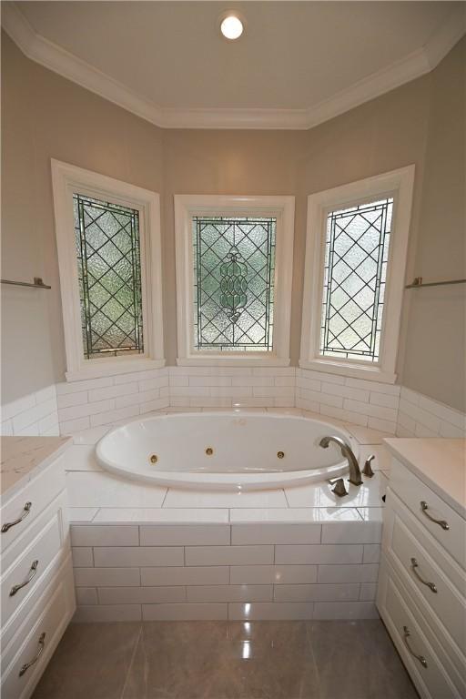 1618 Olivia Way, Auburn, AL 36830 - full bath with vanity, a jetted tub, ornamental molding, and tile patterned flooring
