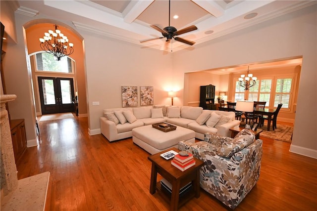 1618 Olivia Way, Auburn, AL 36830 - living area featuring a chandelier, coffered ceiling, ornamental molding, wood finished floors, and beamed ceiling