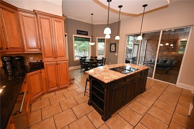 1618 Olivia Way, Auburn, AL 36830 - kitchen featuring black electric stovetop, healthy amount of natural light, backsplash, a center island, and ornamental molding