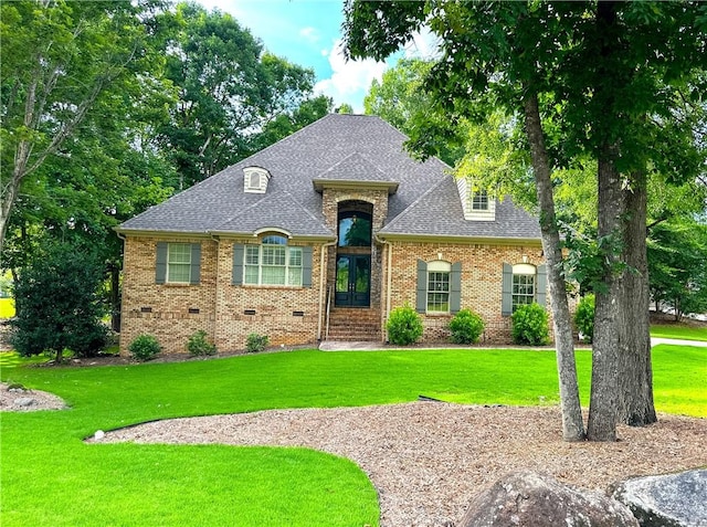 1618 Olivia Way, Auburn, AL 36830 - french country inspired facade featuring a front lawn, a shingled roof, brick siding, and crawl space