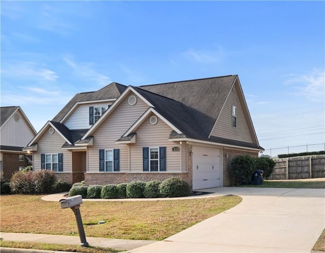 view of front of house featuring a garage and a front yard