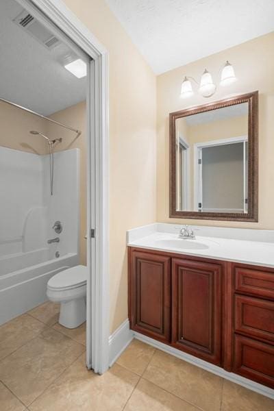 full bathroom featuring tile patterned flooring, vanity, washtub / shower combination, and toilet