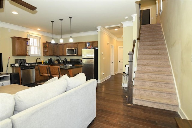 living room featuring stairway, a ceiling fan, crown molding, baseboards, and dark wood-style floors
