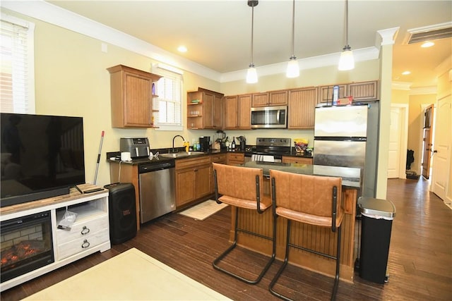 kitchen featuring dark countertops, appliances with stainless steel finishes, open shelves, and a sink