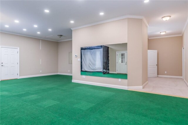 unfurnished living room featuring carpet floors and crown molding