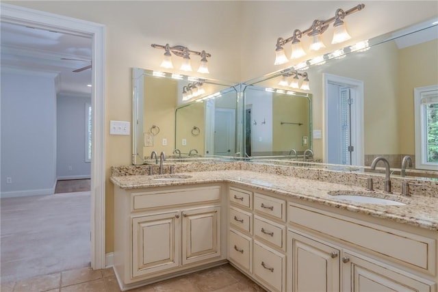 bathroom featuring tile patterned flooring, vanity, and ceiling fan