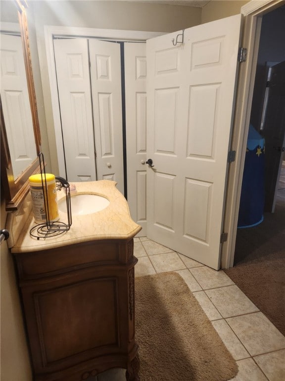 bathroom with tile patterned flooring and vanity