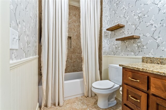 3515 Double Eagle Ln, Opelika, AL 36801 - bathroom with wainscoting, toilet, shower / bath combo, tile patterned floors, and vanity