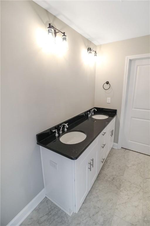 369 Lightness Dr, Auburn, AL 36832 - bathroom with marble finish flooring, baseboards, and double vanity