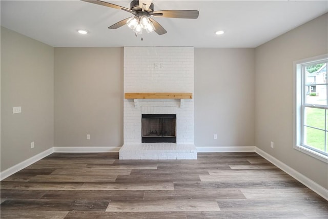 369 Lightness Dr, Auburn, AL 36832 - unfurnished living room featuring ceiling fan, wood finished floors, recessed lighting, baseboards, and a brick fireplace