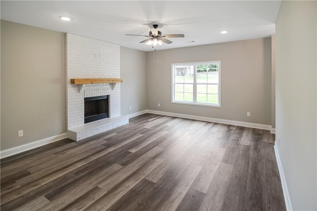 369 Lightness Dr, Auburn, AL 36832 - unfurnished living room with a ceiling fan, baseboards, dark wood-style flooring, a fireplace, and recessed lighting