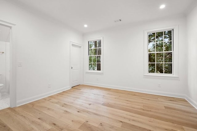 unfurnished room with light hardwood / wood-style floors