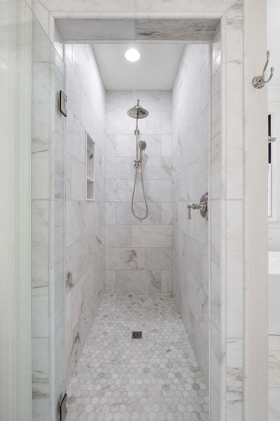 bathroom featuring an enclosed shower