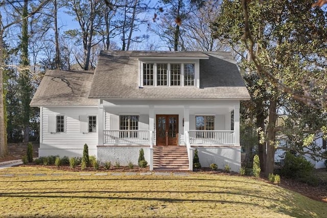 view of front facade featuring a porch and a front yard