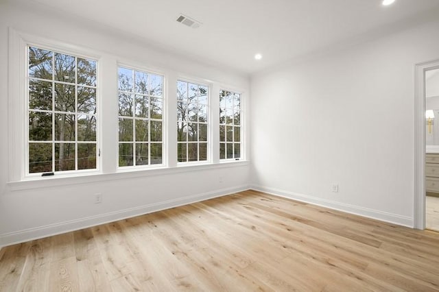 unfurnished room featuring light wood-type flooring