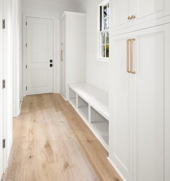 mudroom with light hardwood / wood-style floors