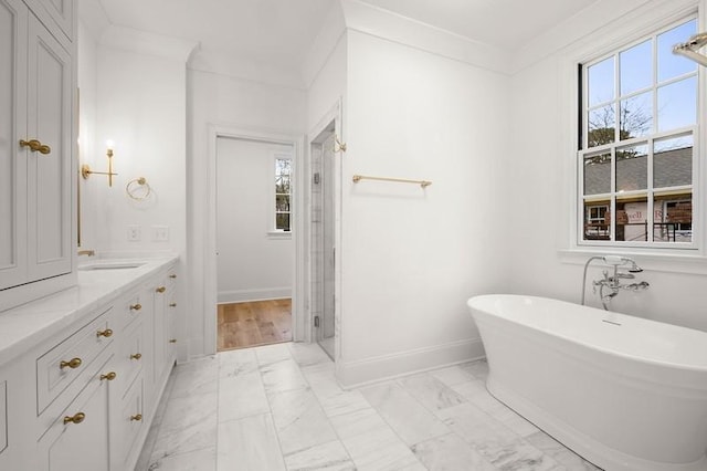 bathroom with shower with separate bathtub, ornamental molding, and vanity