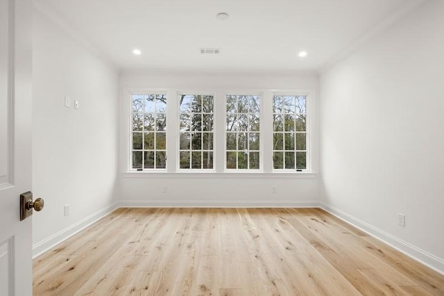 unfurnished room featuring light hardwood / wood-style flooring