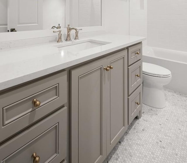 full bathroom with toilet, vanity, tile patterned flooring, and shower / tub combination