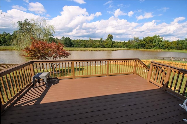 wooden deck featuring a water view