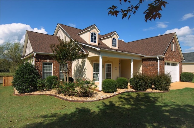 cape cod home with a front yard and a garage