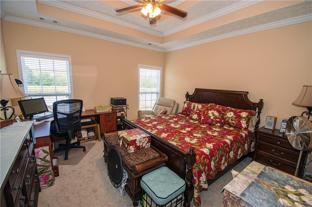 bedroom featuring ceiling fan, crown molding, light carpet, and a tray ceiling