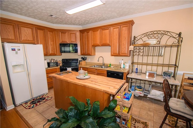 kitchen featuring wood counters, a textured ceiling, crown molding, sink, and black appliances