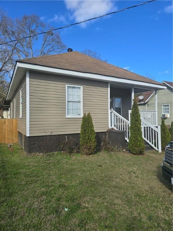 view of property exterior with a lawn